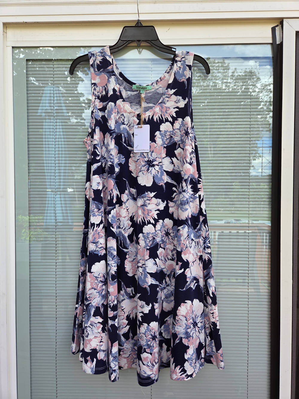 Brand new with tags (NWT) floral sleeveless swing dress from Nostalgia.
